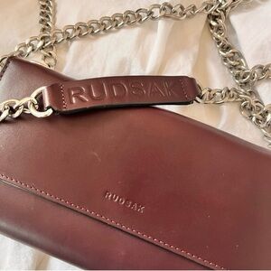 RUDSAK Elegant and Sleek Maroon Leather Crossbody with Silver Chain